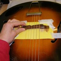 Gibson L48 matching the bridge base to the top contours&nbsp;&copy;&nbsp;2026&nbsp;Guitar Angel