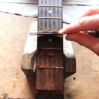 Scraping the fretboard clean&nbsp;&copy;&nbsp;2026&nbsp;Guitar Angel
