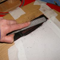 Washburn EA50 Bridge base and saddle lowered to attain a low action&nbsp;&copy;&nbsp;2026&nbsp;Guitar Angel